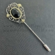 Aguja de azabache, plata, oro y corales